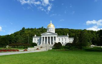 A photo of the Vermont State House in summer